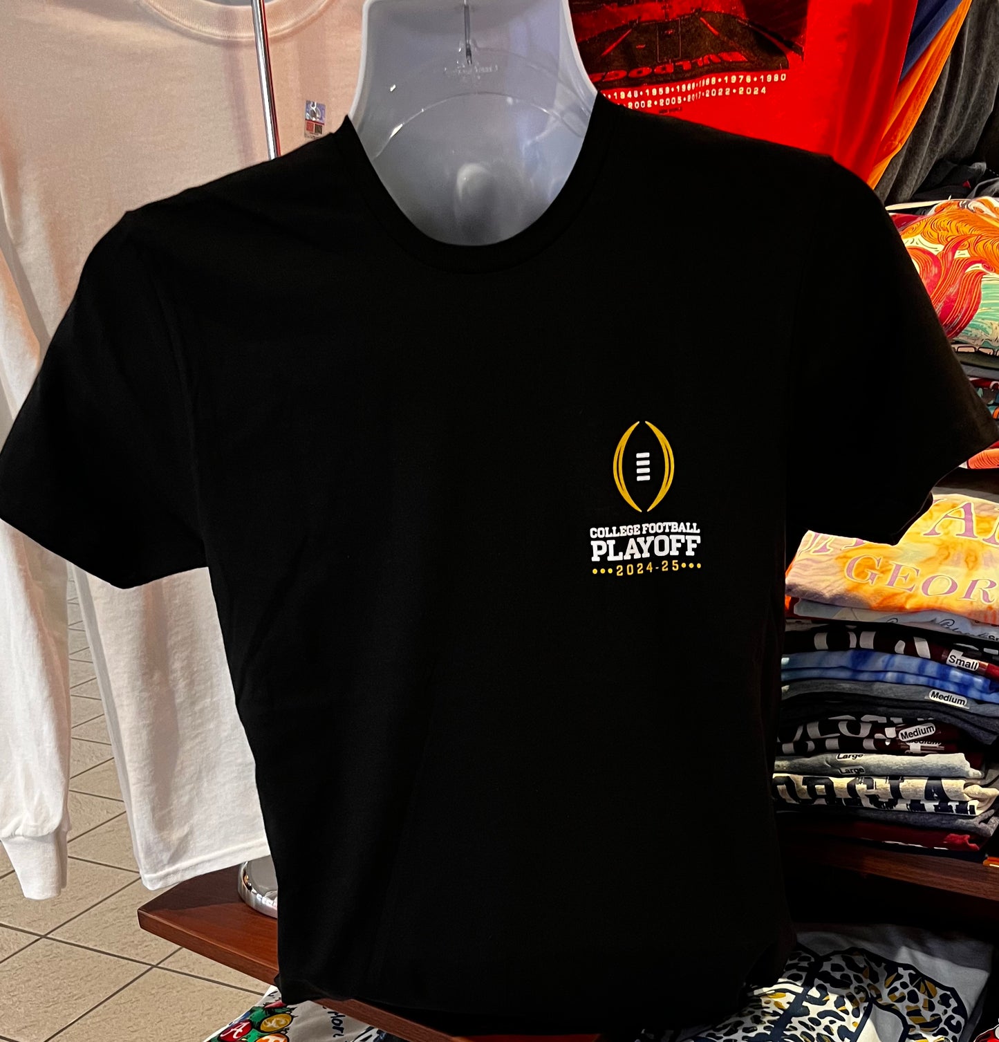 2024 12-Team College Football Playoffs T-shirt - “2024 CFP We’re In Team Helmets Tee” (Short Sleeve Black)